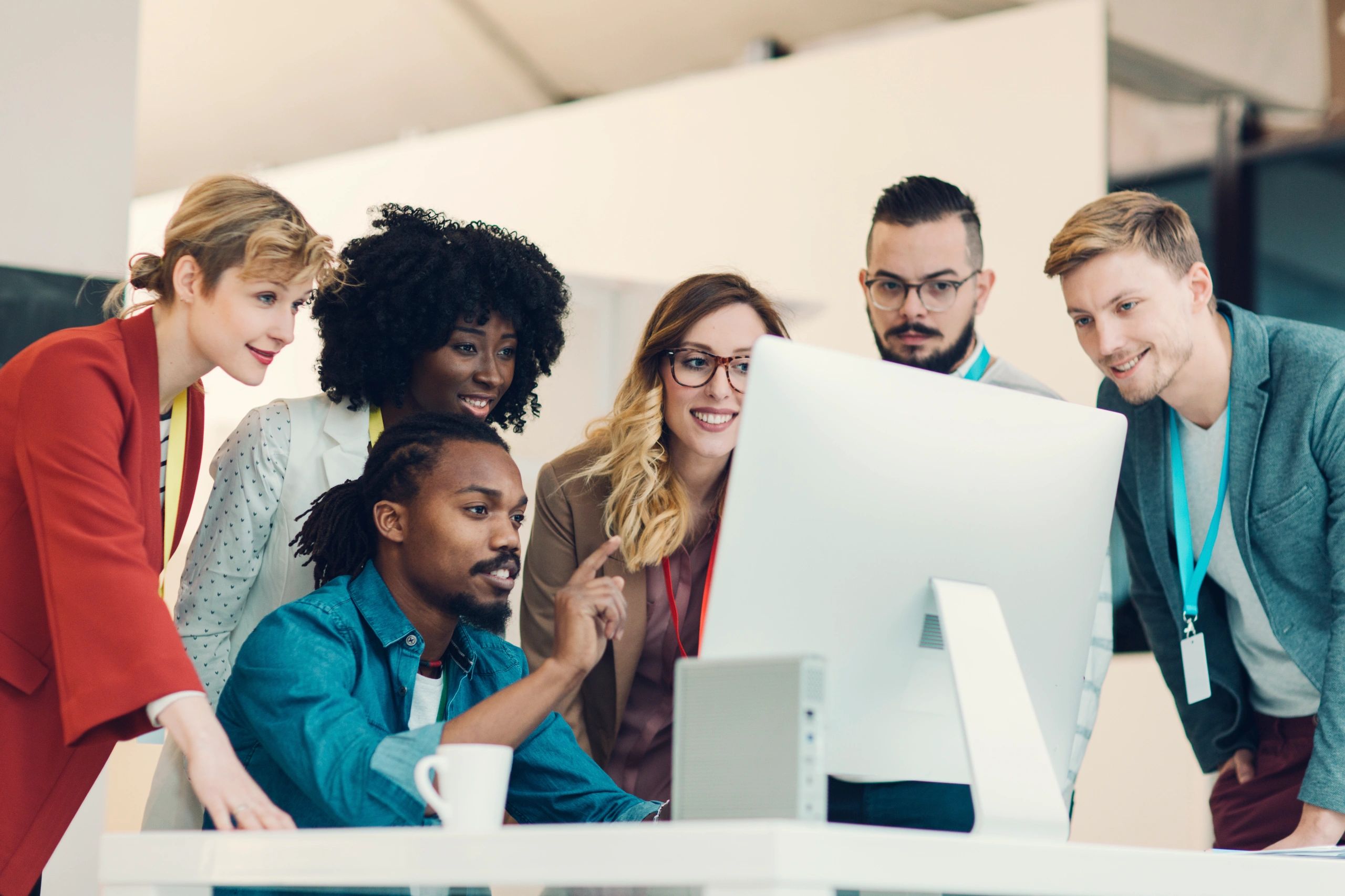 Webroot team collaborating in a modern office